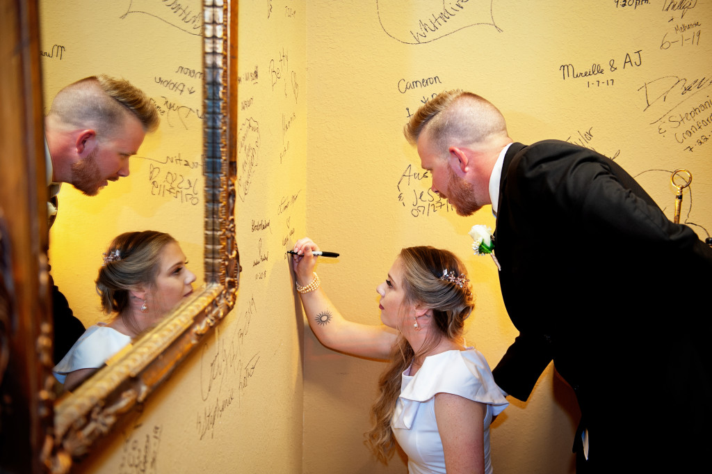 Signing the Wind Dancer wedding wall